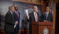 Senator Dick Durbin (D-IL) and Senator Corry Booker (D-NJ) listen to Senate Judiciary Committee Chairman Chuck Grassley (R-IA) speak on the passage of the First Step Act on December 19, 2018 in Washington, DC. Tasos Katopodis/Getty Images/AFP