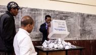 A Malagasy Independent Electoral Commission officers starts the counting operation during the presidential election on December 19, 2018 in Antananarivo, Madagascar. AFP / GIANLUIGI GUERCIA