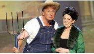 The 13-year-old video from an Emmy Awards broadcast shows the New York born-and-bred, cow-country adverse real estate billionaire dressed as a farmer in denim overalls and a straw hat, wielding a pitchfork while singing the theme song from the popular 196