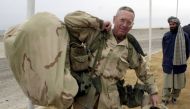 Brigadier General James Mattis carries his packs into the Kandahar International Airport, where he was to set up operations after arriving December 14, 2001. Reuters/Dave Martin
 

