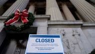 A sign declares the National Archive is closed due to a partial federal government shutdown in Washington, U.S., December 22, 2018. REUTERS/Joshua Roberts 