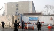  Afghan policemen stand guard outside the government compound after an attack in Kabul, Afghanistan December 25, 2018.REUTERS/Mohammad Ismail	
