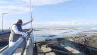 Indian Prime Minister Narendra Modi (C) gestures as he inaugurates India’s longest rail-road bridge at Dibrugarh in Assam on December 25, 2018. (AFP PHOTO / PIB)