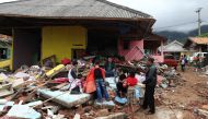 Residents are seen among collapsed buildings following the tsunami waves that hit the coast of Banten and Lampung in South Lampung, Indonesia on December 25, 2018.  Muhammad A.F - Anadolu 