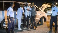  French national Peter Cherif (C) alleged associate of the Kouachi brothers, perpetrators of 2015 Charlie Hebdo attack, steps out a car as he is extradited to France at Djibouti International Airport in Djibouti on December 22, 2018. AFP / Houssein Hersi