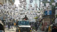Bangladeshi army personnel drive a military vehicle through a street adorned with election posters near a polling station in Dhaka on December 30, 2018. AFP / Munir UZ ZAMAN
