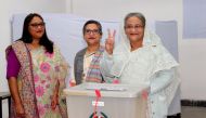Prime Minister Sheikh Hasina gestures after casting her vote in the morning during the general election in Dhaka, Bangladesh, December 30, 2018.