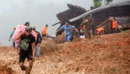 Residents evacuate their homes as rescue workers search for survivors at the site of a landslide triggered by heavy rain in Sukabumi, West Java province on January 1, 2019. AFP 