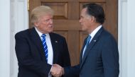 FILE PHOTO: US President-elect Donald Trump shakes hands with Mitt Romney after their meeting at the clubhouse of Trump National Golf Club in Bedminster, New Jersey. January 1, 2019.  AFP / Don EMMERT