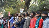Bangladeshi left wing activists wear black cloth over the mouths at a protest against the allegedly fraudlent victory of the ruling Awami League in the recent general eletion, in Dhaka on January 3, 2019. (AFP / Munir UZ ZAMAN)