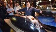President of sushi restaurant chain Sushi-Zanmai, Kiyoshi Kimura (R), displays a 278kg bluefin tuna at his main restaurant in Tokyo on January 5, 2019.   AFP / Kazuhiro NOGI
