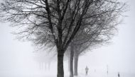 A jogger runs during winter weather in Seeon, Germany, January 5, 2019. REUTERS/Andreas Gebert