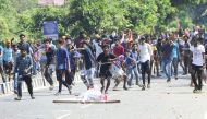 Indian protesters throw stones at police during a demonstration over two women entering the Sabarimala Ayyapa temple, in Palakkad in southern Kerala state on January 3, 2019. AFP / STR