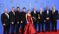 Cast and crew of 'The Americans' including Producer Justin Falvey, Brandon J. Dirden, Keidrich Sellati, Holly Taylor, Producer Joel Fields, producer Joe Weisberg pose in the press room with award for Best Television Series poses in the press room during t