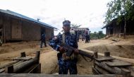 A Myanmar border guard policeman gurads a police station in Buthidaung on January 7, 2019. AFP 