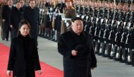 North Korean leader Kim Jong Un (R) and his wife Ri Sol Ju leaving Pyongyang Station to visit China. 