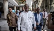 (FILES) In this file photo taken on December 29, 2018 presidential candidate Felix Tshisekedi (C) arrives for a meeting between CENI, SADC and other presidential candidates in Kinshasa, one day ahead of the general elections. AFP / Luis TATO