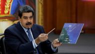 FILE PHOTO: Venezuela's President Nicolas Maduro shows a map while he speaks during a news conference at Miraflores Palace in Caracas, Venezuela, Jan. 9, 2019. REUTERS/Manaure Quintero