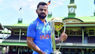  India's cricket team captain Virat Kohli poses with the ICC Cricket World Cup trophy at the Sydney Cricket Ground in Sydney on January 11, 2019. AFP / Saeed Khan