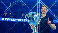 In this file photo taken on November 20, 2016 Britain's Andy Murray poses holding the ATP World Number One trophy after winning the men's singles final against Serbia's Novak Djokovic on the eighth and final day of the ATP World Tour Finals tennis tournam
