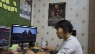 Yakutian filmmaker Lyubov Borisova works on her film in Sakhafilm production studio office in Yakutsk on November 29, 2018.  AFP / Maria Antonova