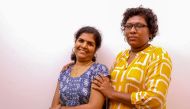 In this photo taken on January 11, 2019, Bindu Ammini (R) and Kanakadurga (L), the two Indian women who entered the Sabarimala Ayyapa temple, pose for photographs during an interview with the media in Kochi in the southern state of Kerala. / AFP / STR /