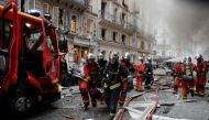 Firefighters evacuate an injured person on a stretcher after the explosion of a bakery on the corner of the streets Saint-Cecile and Rue de Trevise in central Paris on January 12, 2019. AFP / Thomas Samson 