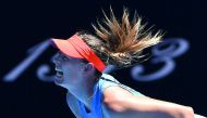 Russia's Maria Sharapova hits a return against Britain's Harriet Dart during their women's singles match on day one of the Australian Open tennis tournament in Melbourne on January 14, 2019. AFP / William West