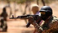In this file photo taken on August 14, 2018 Syrian fighters attend a mock battle in anticipation of an attack by the regime on Idlib province and the surrounding countryside, during a graduation of new Hayat Tahrir al-Sham (HTS) members at a camp in the c
