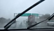 Vehicles make their way under heavy rain on the 710 Freeway in Long Beach, California on January 16, 2019 as southern California is hit by another storm, pushed by an atmospheric river, with rainfall expected to get heavier later into the day. AFP / Frede