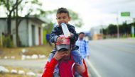 Migrants from Honduras, part of a new caravan from Central America trying to reach the United States, walk along a road in Chiquimula, Guatemala January 16, 2019. Reuters/Jorge Cabrera