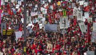 Striking teachers and supporters rally outside City Hall as negotiations resume on January 18, 2019 in Los Angeles, California. David McNew/Getty Images/AFP