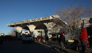 People walk near the entrance to the Paso Del Norte Port of Entry which is a crossing point to enter the United States from Mexico on January 19, 2019, in Ciudad Juarez, Mexico. Joe Raedle/Getty Images/AFP