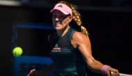 Germany's Angelique Kerber hits a return against Danielle Collins of the US during their women's singles match on day seven of the Australian Open tennis tournament in Melbourne on January 20, 2019. AFP / Peter Parks 