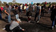 Residents search for human remains and items that could help to identify their missing relatives and friends at the site where a pipeline ruptured by oil thieves exploded, in the municipality of Tlahuelilpan, state of Hidalgo, Mexico January 20, 2019. REU
