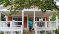 Selina Mack, director of the Durham Community Land Trust in North Carolina, USA, visits a resident living in one of the trust's properties on 17 May 2018. Thomson Reuters Foundation/Gregory Scruggs