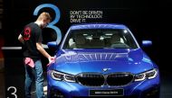 A worker cleans a BMW 3-Series car at Brussels Motor Show, Belgium, January 18, 2019. Reuters/Francois Lenoir
 