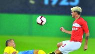 A defender of FC Rostov tackles FC Spartak’s  Ayrton Lucas (right) during the Match Premier Cup at Aspire Academy in Doha yesterday. Pics: Baher Amin/The Peninsula