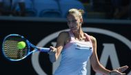 Czech Republic's Karolina Pliskova hits a return against Spain's Garbine Muguruza during their women's singles match on day eight of the Australian Open tennis tournament in Melbourne on January 21, 2019. AFP / Greg Wood 