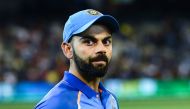 India's captain Virat Kohli arrives on the field for the presentation after defeating Australia during the third one-day international cricket match at the Melbourne Cricket Ground in Melbourne on January 18, 2019. AFP / Jewel Samad