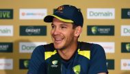 Australia's captain Tim Paine smiles during a press conference at The Gabba in Brisbane on January 23, 2019, ahead of their first day-night Test match between Australia and Sri Lanka on January 24. AFP / ISHARA S. KODIKARA