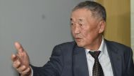 Setev Shaariibuu, the father of murdered young Mongolian woman Altantuya Shaariibuu, who is expected to testify in a civil lawsuit into her daughter's murder arrives in court in Sha Alam on January 22, 2019. / AFP / MOHD RASFAN 