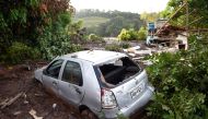 The wrackages of a car and house are seen amid the mud a day after the collapse of a dam at an iron-ore mine belonging to Brazil's giant mining company Vale, near the town of Brumadinho in the state of Minas Gerias in southeastern Brazil, on January 26, 2