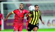 Al Duhail’s Youssef El Arabi (left) and Qatar SC’s Sandro Ferreira Nascimento chase the ball during yesterday’s  semi-final. 