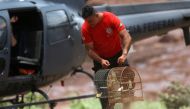A firefighter carries rescued cages after a tailings dam from Brazilian miner Vale SA burst in Brumadinho, Brazil January 27, 2019. Reuters/Adriano Machado