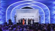 The cast of Black Panther celebrate on stage after the film won Outstanding Performance by a Cast in a Motion Picture. REUTERS/Mike Blake