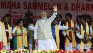 Indian Prime Minister Narendra Modi (C) waves during a public meeting at Thakurnagar area, some 75 km northeast of Kolkata, in the Indian state of West Bengal on February 2, 2019. / AFP 