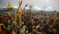 Indian naked sadhu (Hindu holy man) walk in a procession towards Sangam -- the confluence of the Ganges, Yamuna and mythical Saraswati rivers -- during the auspicious bathing day of 'Mauni Amavasya' at the Kumbh Mela in Allahabad on February 4, 2019. / AF