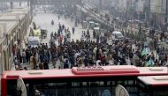 In this picture taken on January 20, 2019, mourners block a road in protest in Lahore, after members of a family were killed by police in an encounter in Sahiwal. AFP / Arif ALI 