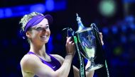 Ukraine’s Elina Svitolina holds up the winner’s trophy after defeating Sloane Stephens of the US in their singles final match at the WTA Finals in Singapore in this file picture.